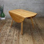 mid-century_ercol_elm_drop_leaf_round_dining_table_model_384