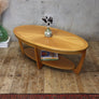 mid_century_oval_teak_coffee_table