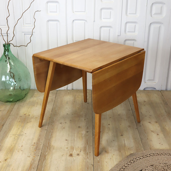 mid_century_ercol_drop_leaf_rectangular_dining_table.