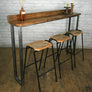 A Set of Three Rustic Bar Height Stools