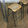 A Set of Three Rustic Bar Height Stools